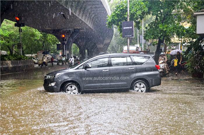 Toyota Innova Crysta driving through flood